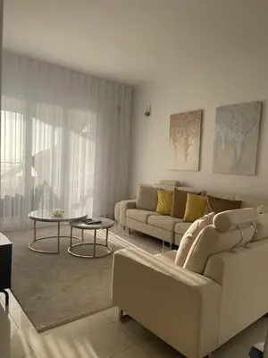 a living room with a couch and a table at Luxury villa with private heated pool, garden and views of the sea and mountains. in Arco da Calheta