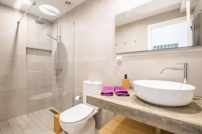 a bathroom with a sink and a toilet and a shower at Recanto da Princesa by Homie in Funchal