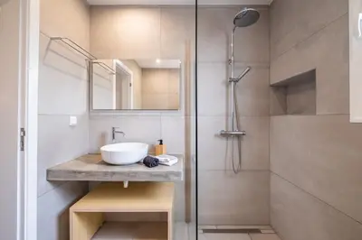 a bathroom with a sink and a shower at Recanto da Princesa by Homie in Funchal