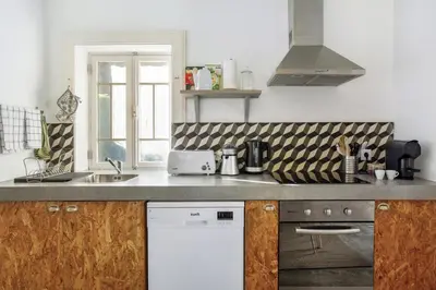 a kitchen with a table with a bowl on it at Calheta Beach House T1 in Calheta