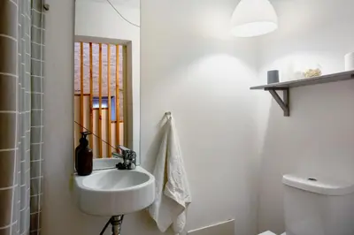 a bathroom with a sink and a mirror at Calheta Beach House T2 in Calheta