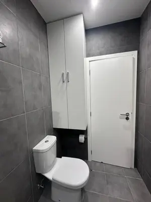 a bathroom with a shower and a purple rug at Quiet Place in Machico