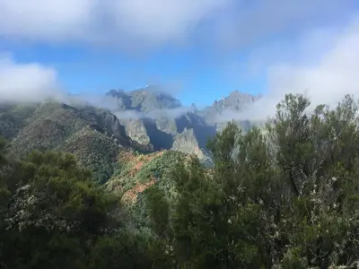 a view of the mountains with clouds in the background at Quiet Place in Machico