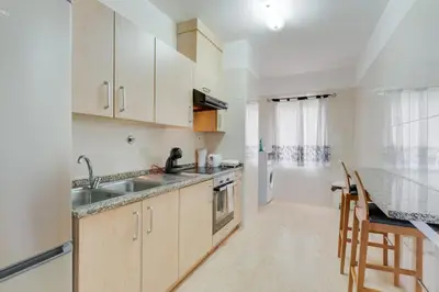 a kitchen with a sink and a counter top at Santa Cruz Apartment with Sea View by Holiday Rental Madeira in Santa Cruz