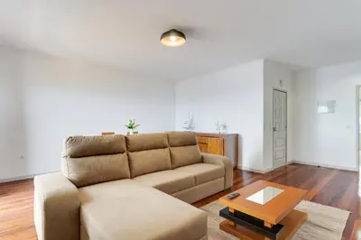 a living room with a couch and a table at Santa Cruz Apartment with Sea View by Holiday Rental Madeira in Santa Cruz