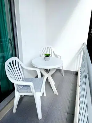 a white table and two chairs on a balcony at Ocean Pearl Apartment X in Funchal