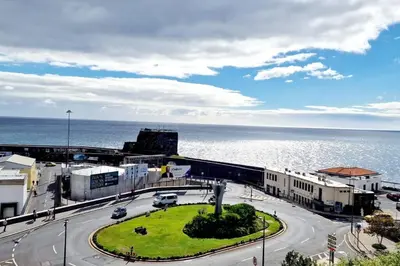 a street in a city with the ocean in the background at Ocean Pearl Apartment X in Funchal