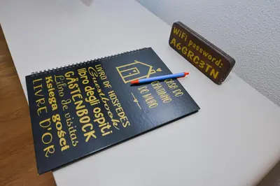 a book with a pencil on top of it at Casa do Cantinho do Muro in São Vicente