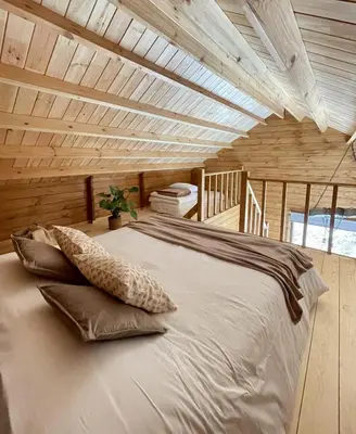 a large bed in a room with a wooden ceiling at Mountain Eco Shelter 5 in Funchal