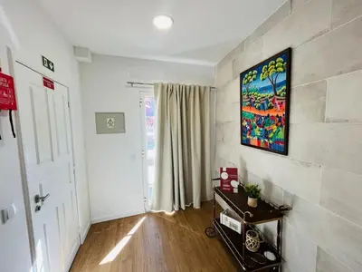 a living room with a painting on the wall at Charming Funchal Studio II in Funchal