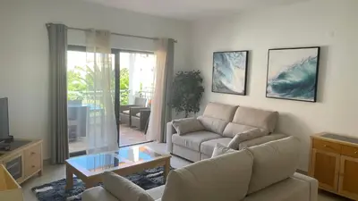 a living room with a couch and a coffee table at Amazing 2 Bedroom Apartment near beach with pool in Lagos