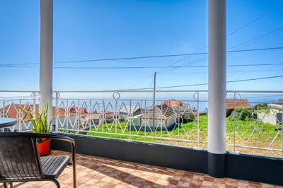 a balcony with a view of the ocean at Casa do Valentim, a Home in Madeira in Ponta do Sol