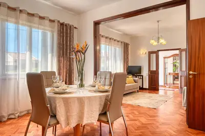 a dining room with a table and chairs at Casa do Valentim, a Home in Madeira in Ponta do Sol