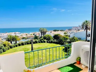 a balcony with a view of the ocean at Avenue Q, Beach Apartment in Luz in Luz