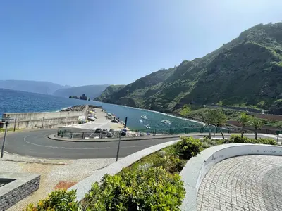 a winding road next to a body of water at CASA CAROTO in Porto Moniz