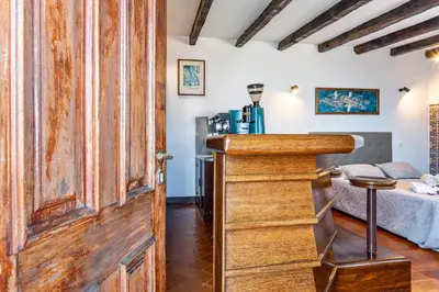 a bedroom with a bed and a large wooden counter top at Panoramic Views I I in Caniço