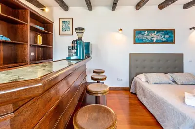a living room with a couch and a counter top at Panoramic Views I I in Caniço
