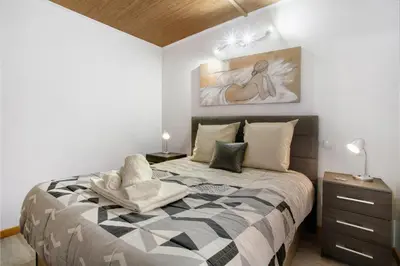 a bedroom with a large bed in a room at Panoramic Views I in Caniço