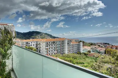 a view of a city from the balcony of a building at Panoramic Views I in Caniço