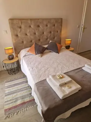 a bedroom with a large bed with two towels on it at Lovely Apartment Funchal in Funchal