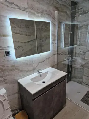 a bathroom with a sink and a shower at Lovely Apartment Funchal in Funchal