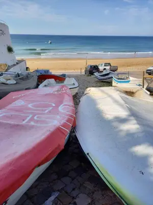 a group of kayaks and boats on a beach at Casa Luna, Burgau - Luz, Lagos in Burgau