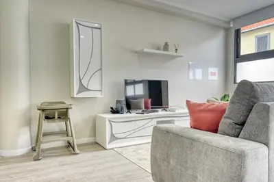 a living room with a couch and a table at Tristão Vaz II, a Home in Madeira in Machico