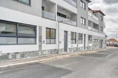 an empty street in front of a building at Tristão Vaz II, a Home in Madeira in Machico