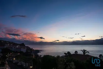 a view of the ocean at sunset at Apartment with ocean view and parking in Funchal