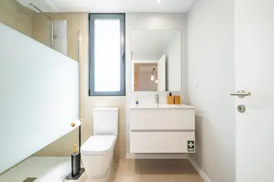 a bathroom with a toilet and a sink at Apartment with ocean view and parking in Funchal
