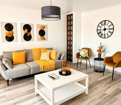 a living room with a couch and a table at Stay In Madeira in Funchal