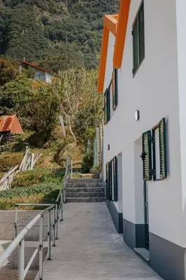 a stairway leading to the side of a building at The Passion Fruit House in São Vicente