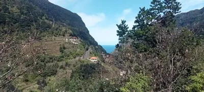 a mountain covered in trees and bushes at Hikers Comfort in Boaventura