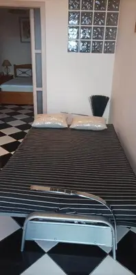 a large bed in a room with at Residência Mendonça in Faial