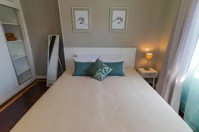 a bedroom with a bed with two pillows on it at Blue House in Ponta do Sol