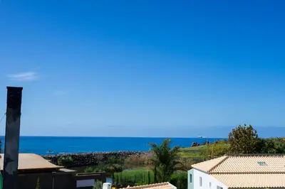 a view of the ocean from a house at Blue House in Ponta do Sol