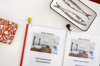 a display of the caja branson museum with a wand and photos of furniture at Casa Branca in Luz