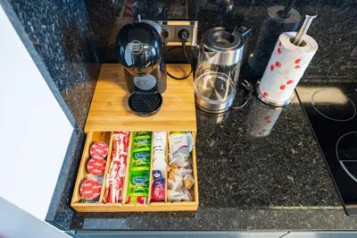 a table with a blender and food on a counter at Serenity by the Sea in Funchal