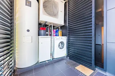 a laundry room with a washer and dryer at Serenity by the Sea in Funchal