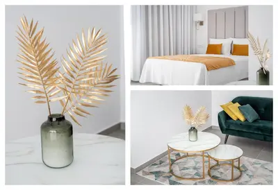 a vase with a palm tree in a room at Vila Luna B&B in Lagos
