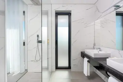 a bathroom with a sink and a shower at Vila Luna B&B in Lagos