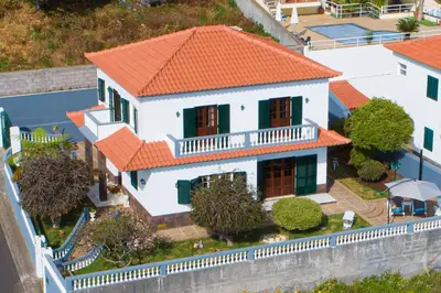 an aerial view of a house with an orange roof at Garden House in Funchal