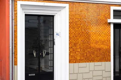 an entrance to a brick building with a door at Apartamentos Progresso 1º Esq in Funchal
