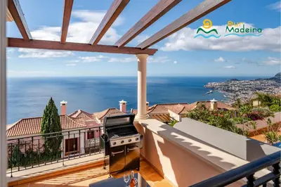 a view of the ocean from the balcony of a house at OurMadeira - Palheiro Ocean in Funchal