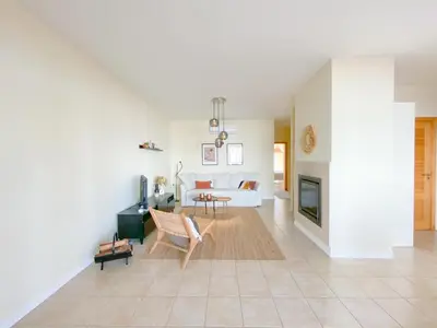 a living room with a couch and a fireplace at Cozy Retreat for Couples in Burgau #1937 in Burgau