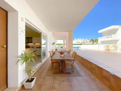 a dining table on the balcony of a house at Cozy Retreat for Couples in Burgau #1937 in Burgau