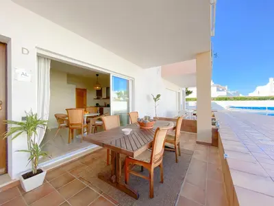 a dining room with a table and chairs on a patio at Cozy Retreat for Couples in Burgau #1937 in Burgau
