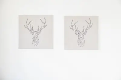 two drawings of a deer head with antlers at Apartamentos Progresso 1º Dto in Funchal