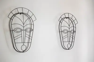 a drawing of a mask on a white background at Apartamentos Progresso 2º Dto in Funchal