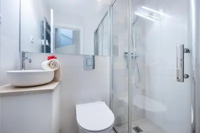 a bathroom with a toilet sink and a shower at CoolHouses Algarve Luz, 3 Bed townhouse, lovely sea views, village centre, Casa Limoeiro 54LBC in Luz